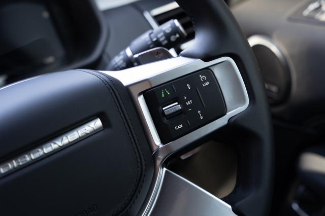 Land Rover Discover D300 Dynamic SE steering wheel buttons controlling adaptive cruise control and lane keeping assist systems.