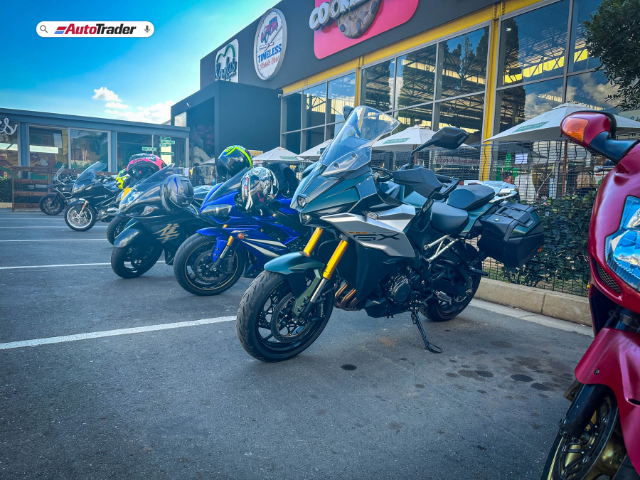 Suzuki GSX S1000 parked outside shop