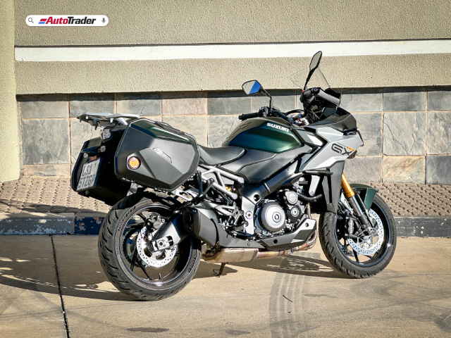 rear view of Suzuki GSX S1000 GX parked in front of wall
