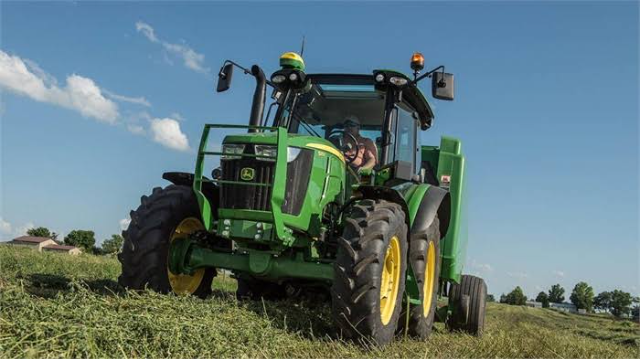 The tractor is equipped with large, rugged tires suitable for agricultural work.
