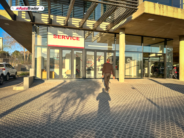 Employee entering service centre at dealership