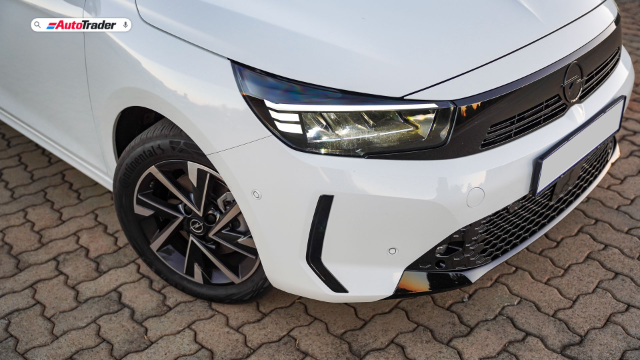 Close up of the front corner of a white Opel Corsa GS showing the LED headlight and 16-inch alloy wheel