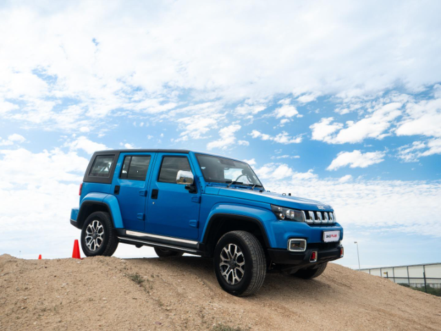 A blue B40 Plus parked on a dune.