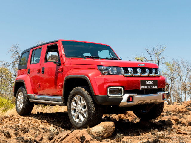 A red bAIC B40 Plus packed on rugged terrain
