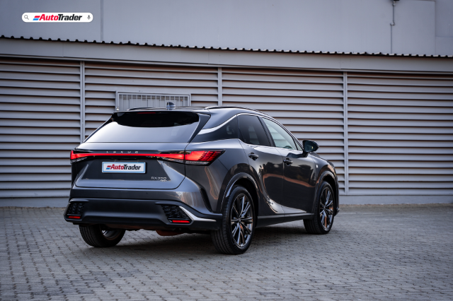Rear three quarter view of a dark grey Lexus RX F-Sport