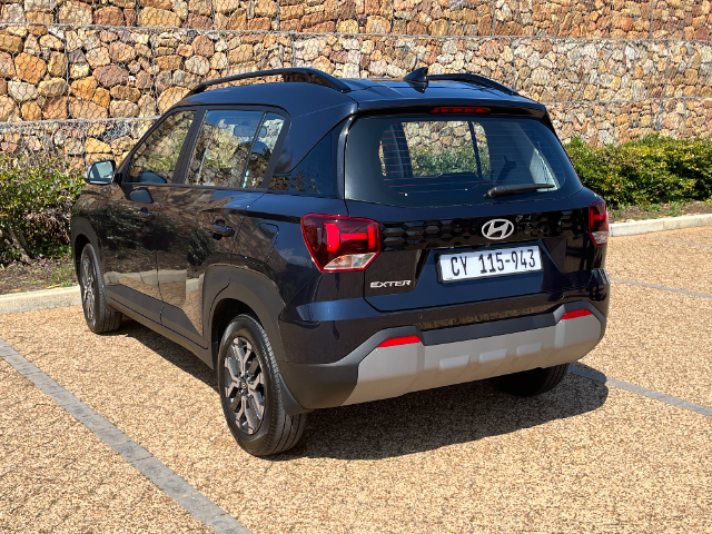 Rear-3-quarter view of the Exter in Executive trim.