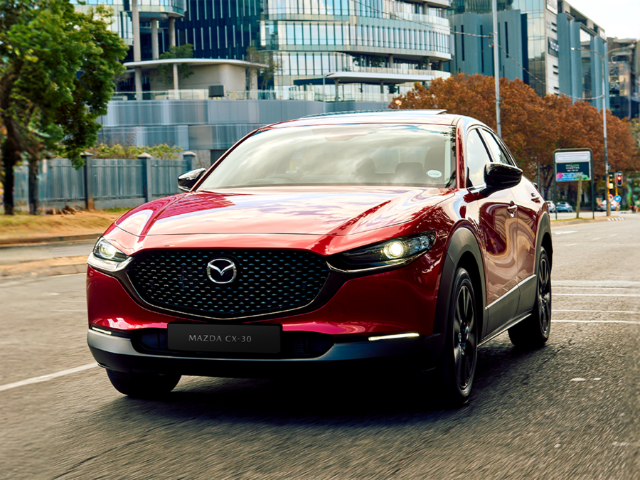 Front three-quarter view of a Soul Red Mazda CX-30