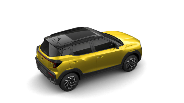 A Mahindra XUV 3OO in a vibrant citrine yellow color, viewed from a high rear three-quarter angle. The compact SUV features a sleek design with black accents on the roof, side mirrors, and lower body panels. The vehicle is equipped with stylish alloy wheels and has a modern, sporty appearance.