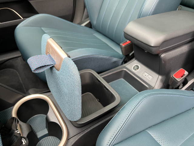 Storage cubbies include an upmarket lidded box between the front seats.