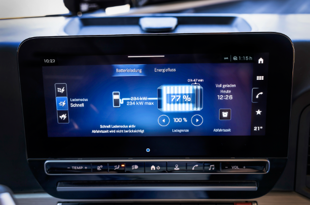 The image shows a digital car dashboard displaying charging information, indicating the battery is at 77% with an estimated 47 minutes until fully charged.