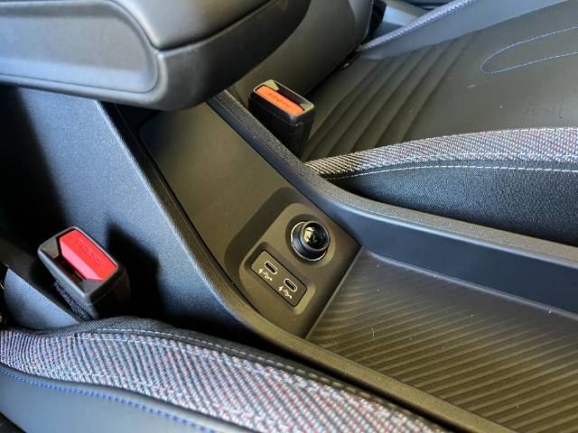 The placement of the USB-C ports is practical - it's between the two front seats.