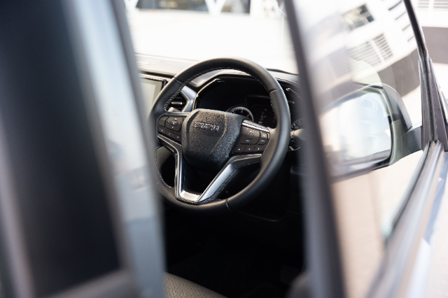 The steering wheel of the D-Max in V-Cross trim.