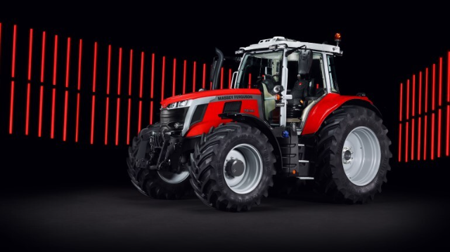  A bright red and black Massey Ferguson tractor is prominently displayed against a dramatic black background with vertical red light bars in the distance. The tractor features large tires, a modern design, and a spacious cabin.