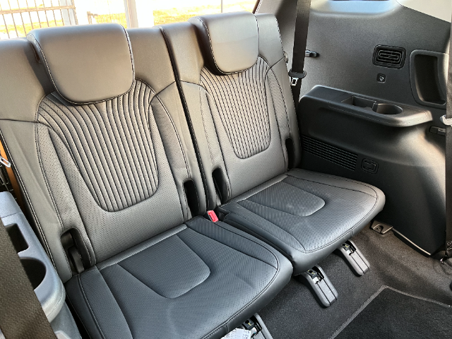 The rearmost seats are tight, but the children won't complain.