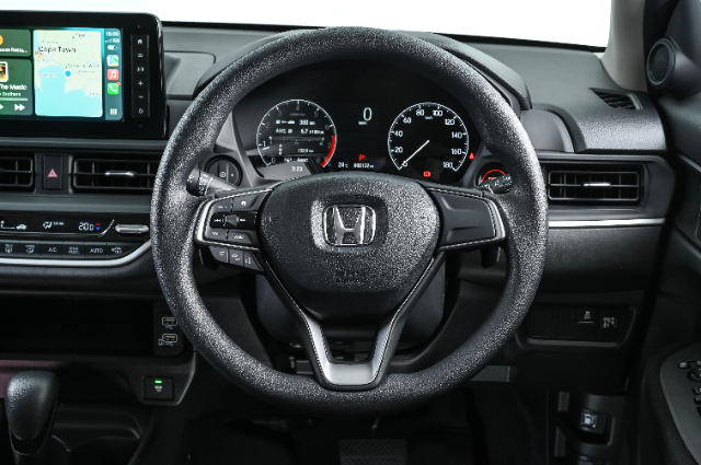 Close-up view of the steering wheel in the Amaze (top spec).