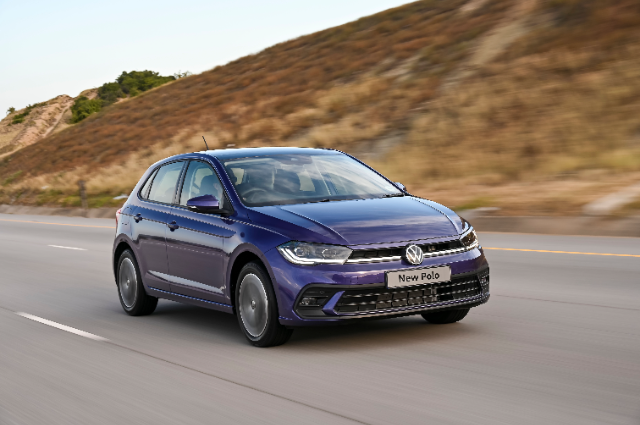 A Blue Polo driving on the highway