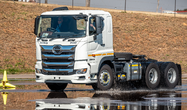 The image appears to capture a Hino 700 series heavy-duty truck, labelled with "HINO 700" and possibly "2845," likely indicating its model or specifications. 