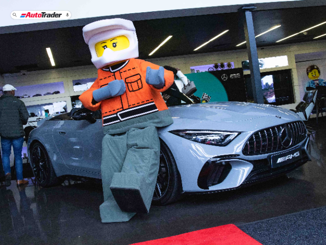 LEGO Character posing with Mercedes-AMG SL 63