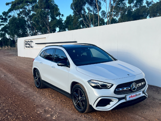 The Mercedes-Benz GLA parked next to a white wall.