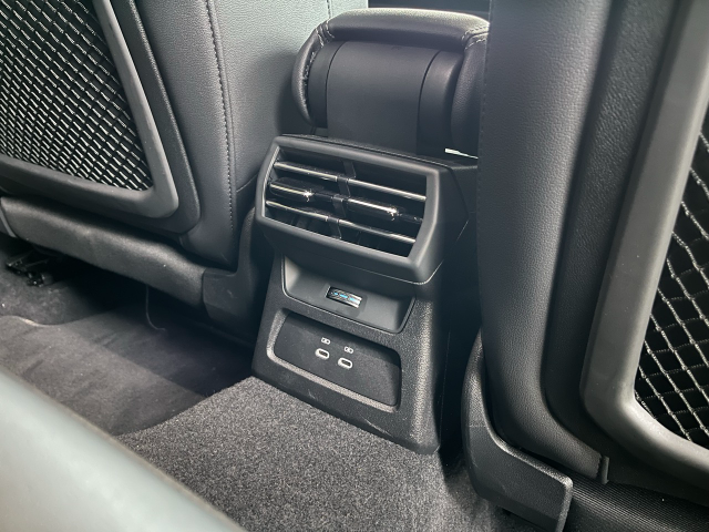 Rear passengers have air vents and two USB-A ports.