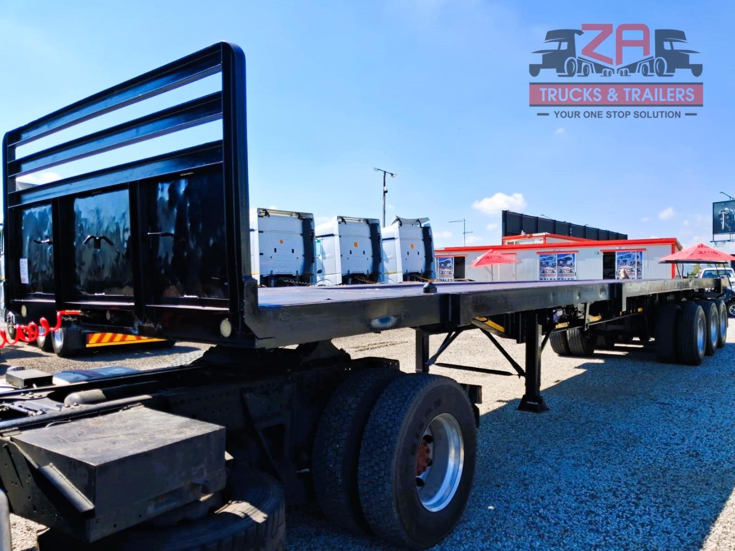 TOP TRAILER TRI-AXLE FLAT DECK *BARGAIN DEAL! Za Trucks and Trailers
