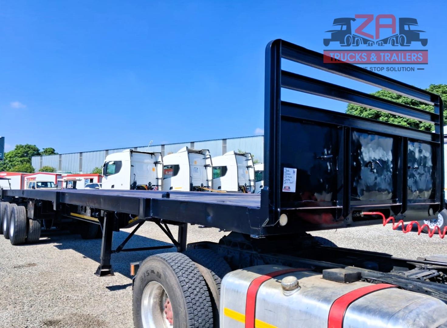 TOP TRAILER TRI-AXLE FLAT DECK *BARGAIN DEAL! Za Trucks and Trailers