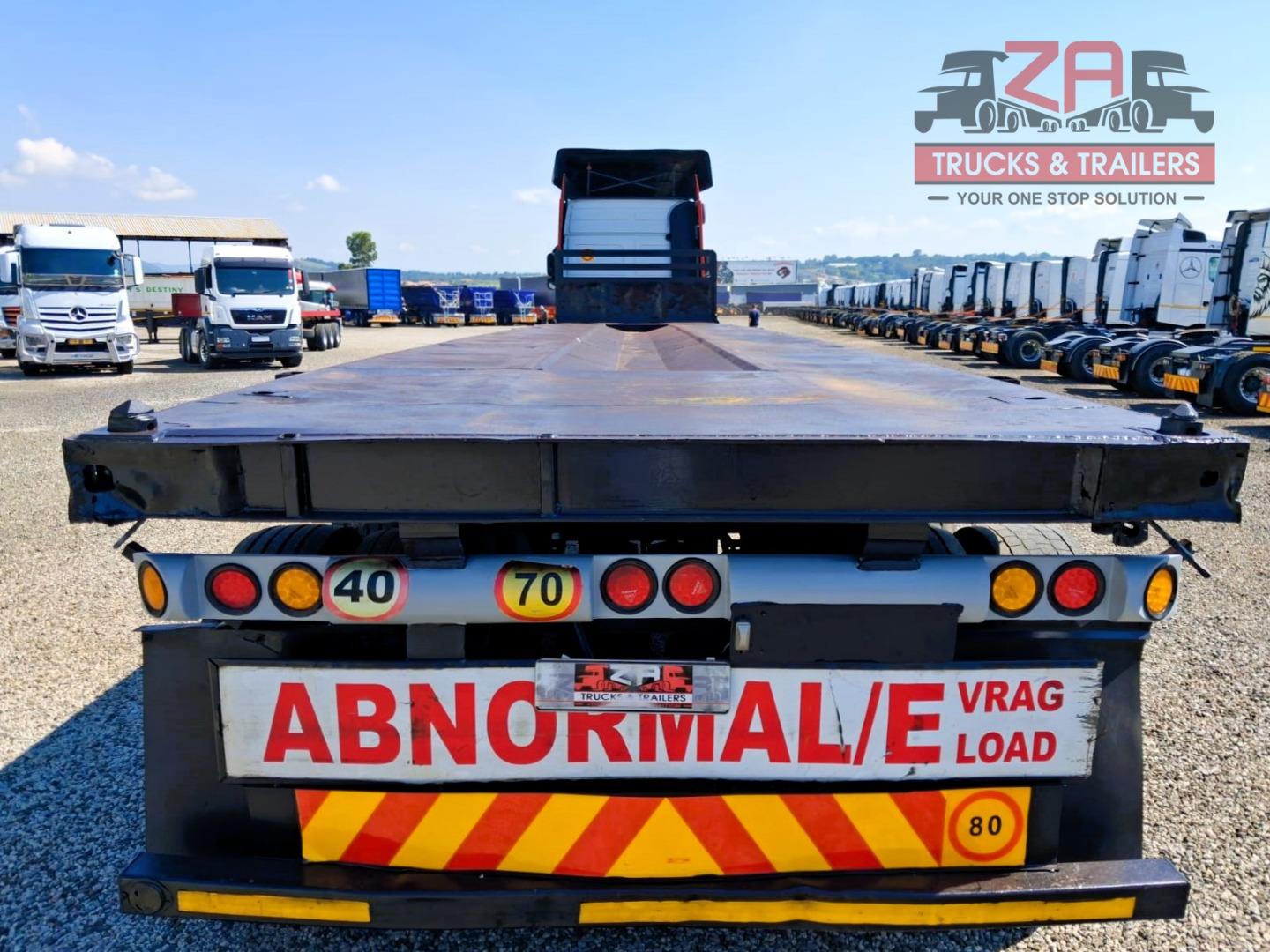 TOP TRAILER TRI-AXLE FLAT DECK *BARGAIN DEAL! Za Trucks and Trailers
