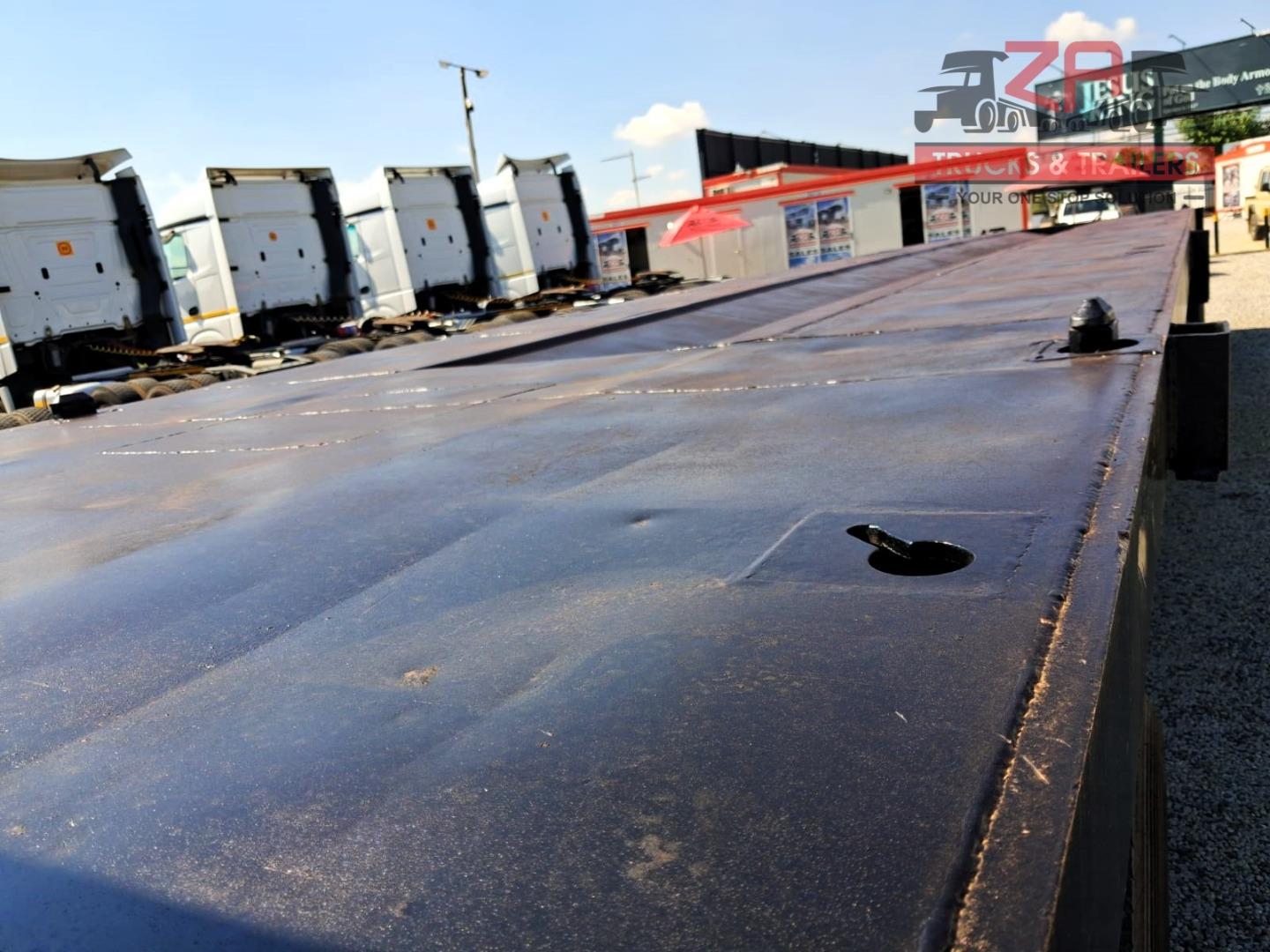 TOP TRAILER TRI-AXLE FLAT DECK *BARGAIN DEAL! Za Trucks and Trailers