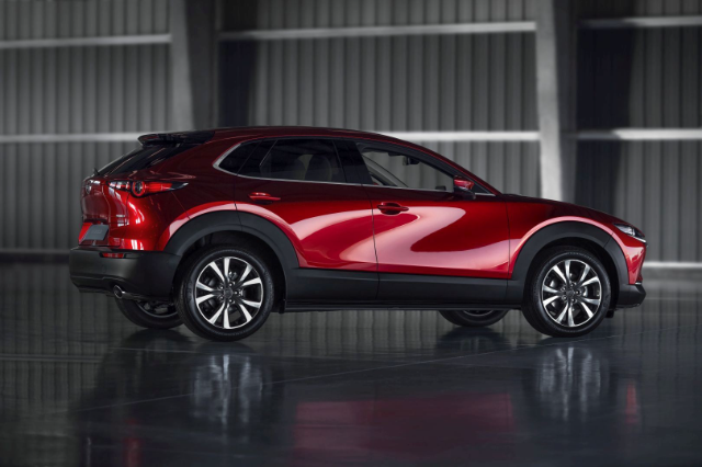Side view of the red Mazda CX-30.