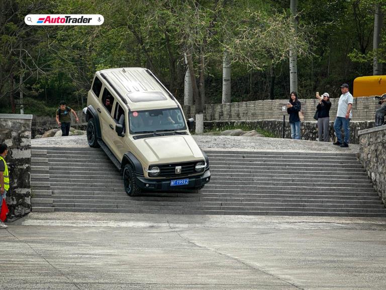 Tank 300 driving down a flight of stairs