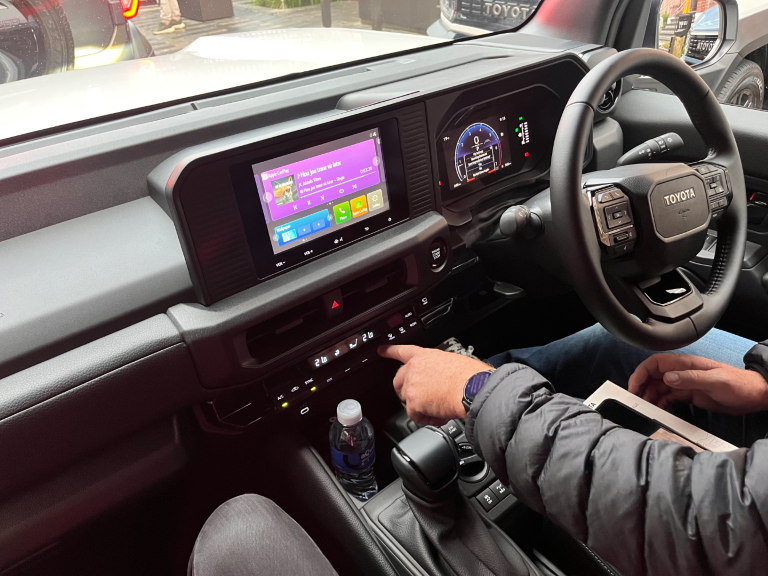 The system is Apple CarPlay and Android Auto compatible in both trims. (VX on image)