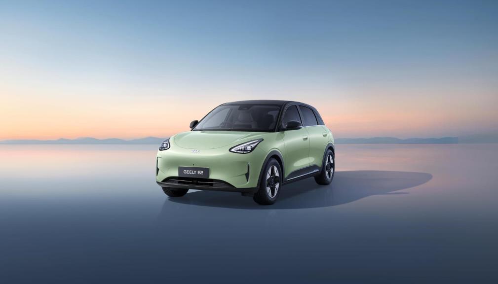 Geely E2 electric hatchback in mint green with a black roof, studio front three-quarter view.