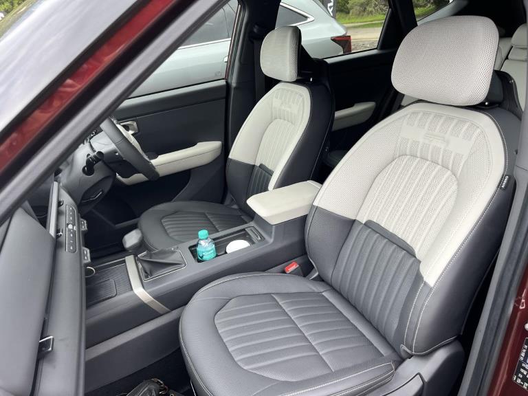 All-white seats would have stained easily over time, the dual-coloured design looks cool and better for longer!