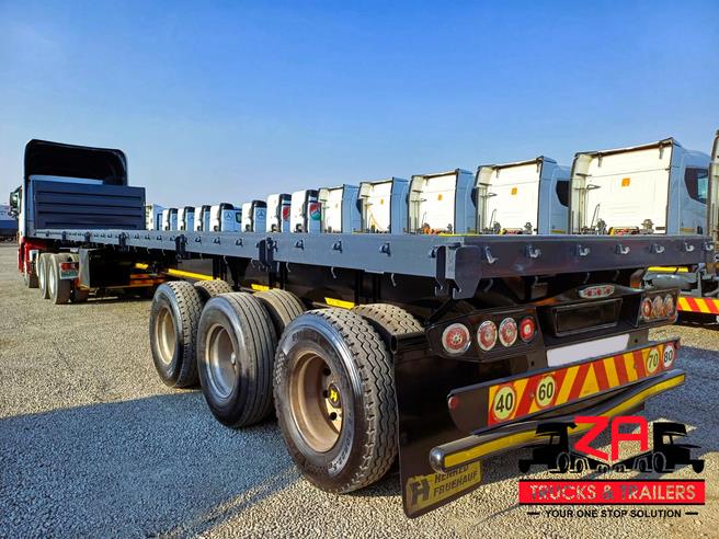 HENRED FRUEHAUF TRI-AXLE FLAT DECK TRAILER OCT PRICE DROP! Za Trucks and Trailers