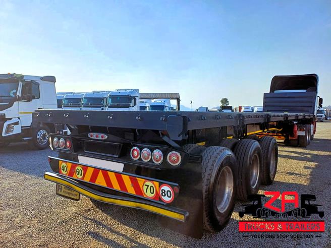 HENRED FRUEHAUF TRI-AXLE FLAT DECK TRAILER OCT PRICE DROP! Za Trucks and Trailers