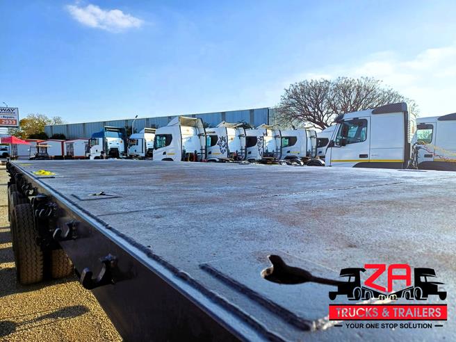 HENRED FRUEHAUF TRI-AXLE FLAT DECK TRAILER OCT PRICE DROP! Za Trucks and Trailers